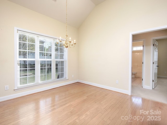 126 Dairy Farm Rd, Mooresville, NC 28115 - unfurnished dining area featuring a chandelier, light wood-style floors, baseboards, and lofted ceiling