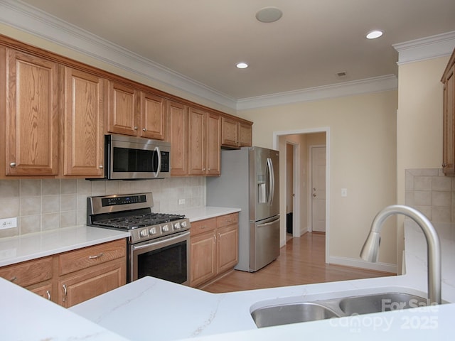 126 Dairy Farm Rd, Mooresville, NC 28115 - kitchen featuring a sink, decorative backsplash, appliances with stainless steel finishes, and crown molding