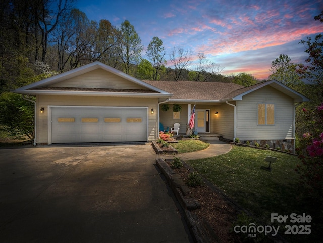 1424 Wolfpen Rd, Old Fort, NC 28762 - ranch-style house featuring driveway, a garage, a front lawn, covered porch, and a shingled roof