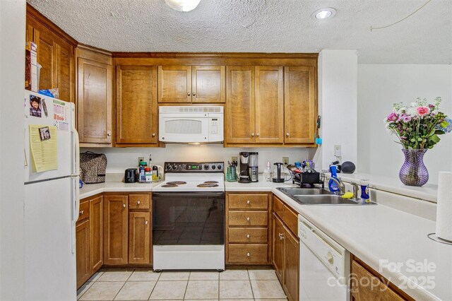 800 Meadowview Dr Unit # 2, Boone, NC 28607 - kitchen featuring white appliances, brown cabinets, and a textured ceiling
