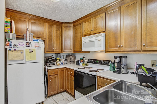 800 Meadowview Dr Unit # 2, Boone, NC 28607 - kitchen with white appliances, a sink, brown cabinets, light countertops, and a textured ceiling