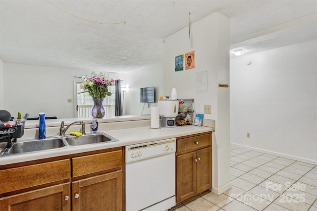 800 Meadowview Dr Unit # 2, Boone, NC 28607 - kitchen featuring dishwasher, a sink, a textured ceiling, brown cabinetry, and light tile patterned floors