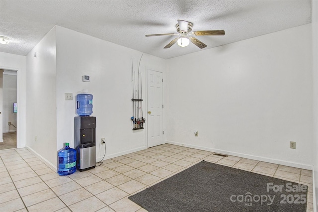 800 Meadowview Dr Unit # 2, Boone, NC 28607 - empty room with a textured ceiling, light tile patterned flooring, a ceiling fan, and baseboards