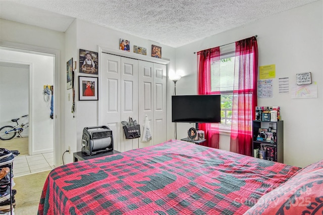 800 Meadowview Dr Unit # 2, Boone, NC 28607 - tiled bedroom with a closet, carpet, and a textured ceiling