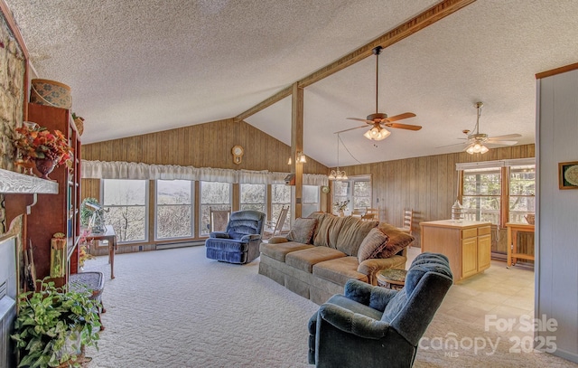 living room with light carpet, a textured ceiling, vaulted ceiling, and ceiling fan