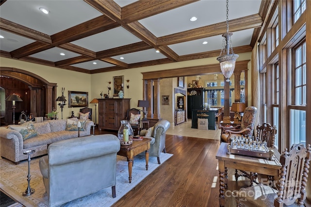 205 W Indrio Rd, Blowing Rock, NC 28605 - living area featuring beamed ceiling, arched walkways, wood finished floors, coffered ceiling, and ornate columns