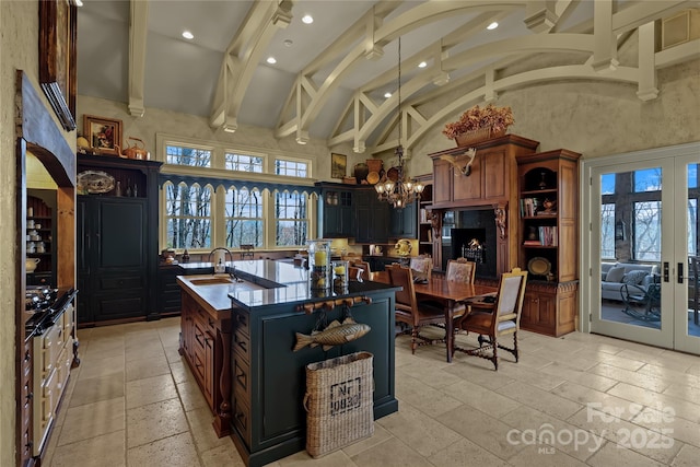 205 W Indrio Rd, Blowing Rock, NC 28605 - kitchen with french doors, a chandelier, dark countertops, a sink, and open shelves