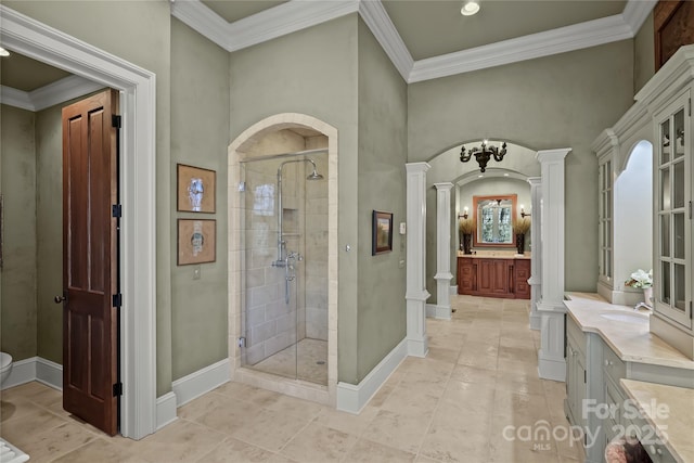 205 W Indrio Rd, Blowing Rock, NC 28605 - bathroom featuring ornate columns, a stall shower, vanity, toilet, and ornamental molding