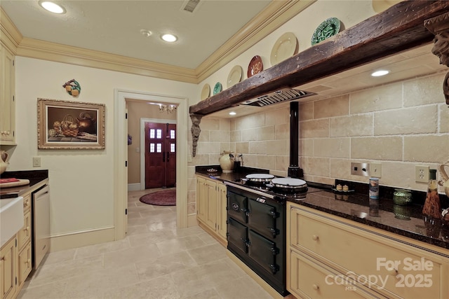 205 W Indrio Rd, Blowing Rock, NC 28605 - kitchen featuring cream cabinetry, crown molding, dark stone countertops, decorative backsplash, and dishwasher