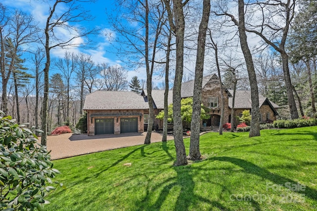 205 W Indrio Rd, Blowing Rock, NC 28605 - view of green lawn featuring driveway and an attached garage
