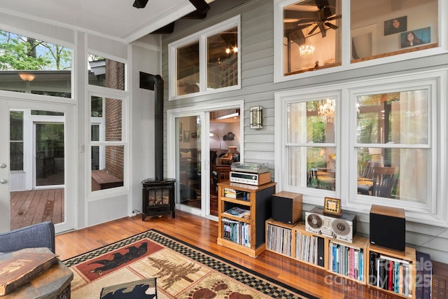 sunroom with a wood stove