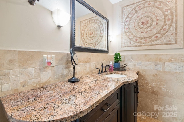 bathroom with vanity and backsplash