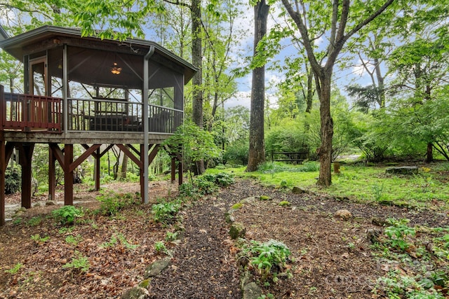 view of yard with a sunroom