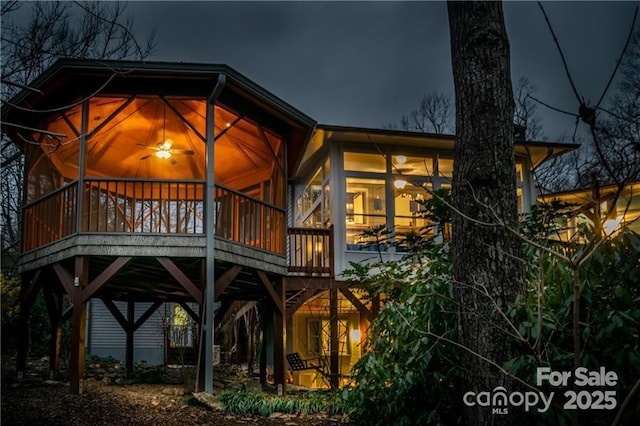 back of house featuring a deck