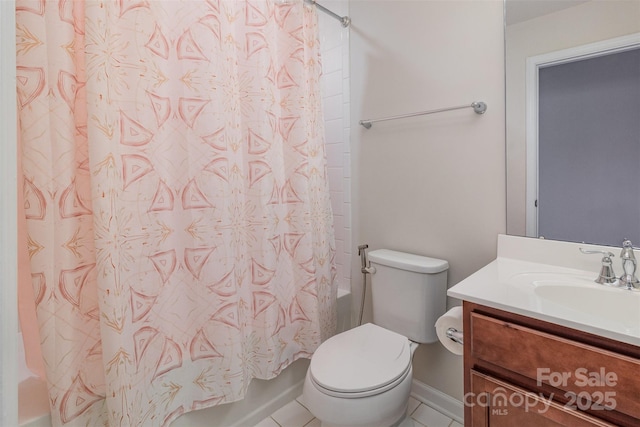 full bath featuring tile patterned flooring, shower / bath combo, vanity, baseboards, and toilet