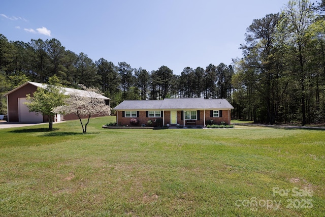 5381 Mount Carmel Rd, Heath Springs, SC 29058 - single story home with a garage, a front yard, brick siding, and a view of trees