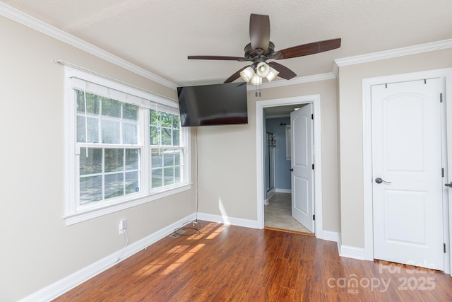 5381 Mount Carmel Rd, Heath Springs, SC 29058 - unfurnished bedroom with baseboards, ornamental molding, a textured ceiling, ceiling fan, and wood finished floors
