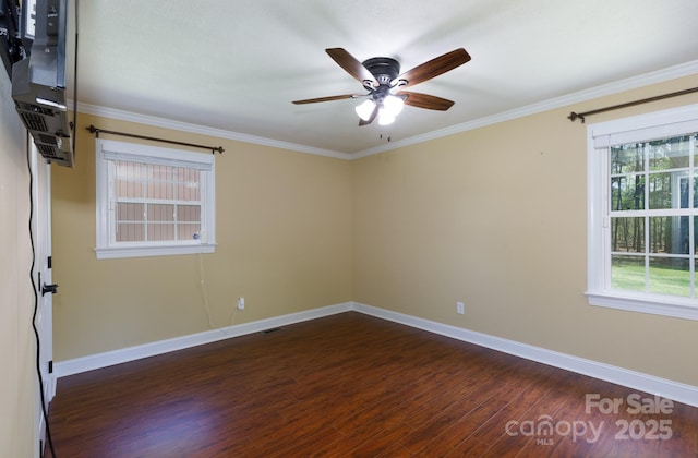 5381 Mount Carmel Rd, Heath Springs, SC 29058 - spare room featuring dark wood-type flooring, baseboards, ornamental molding, and ceiling fan