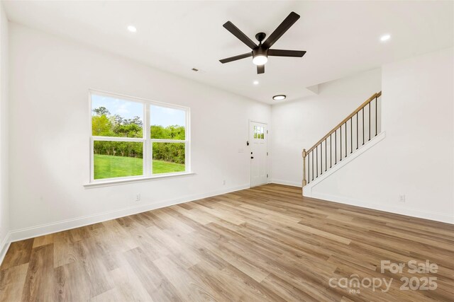 2043 Greenoak Dr, Shelby, NC 28152 - unfurnished living room featuring baseboards, light wood-type flooring, recessed lighting, stairway, and a ceiling fan