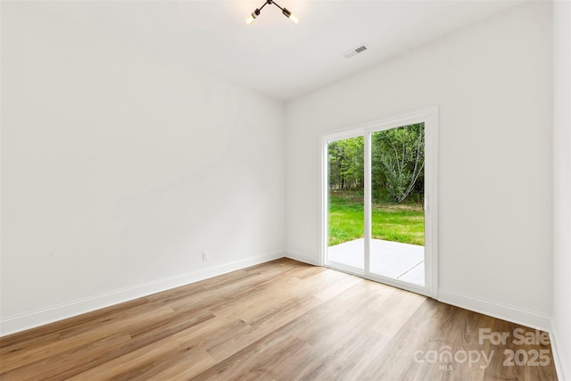 2043 Greenoak Dr, Shelby, NC 28152 - unfurnished room featuring visible vents, light wood-style flooring, and baseboards