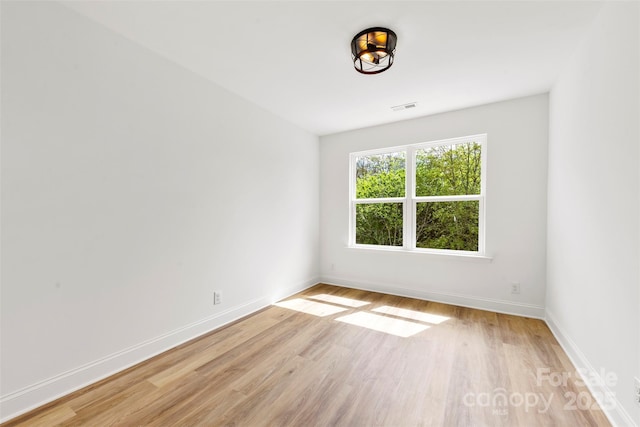 2043 Greenoak Dr, Shelby, NC 28152 - unfurnished room with light wood finished floors, visible vents, and baseboards