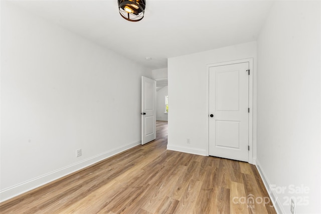 2043 Greenoak Dr, Shelby, NC 28152 - unfurnished bedroom with light wood-style flooring and baseboards