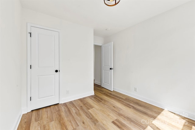 2043 Greenoak Dr, Shelby, NC 28152 - unfurnished bedroom with light wood-style flooring and baseboards
