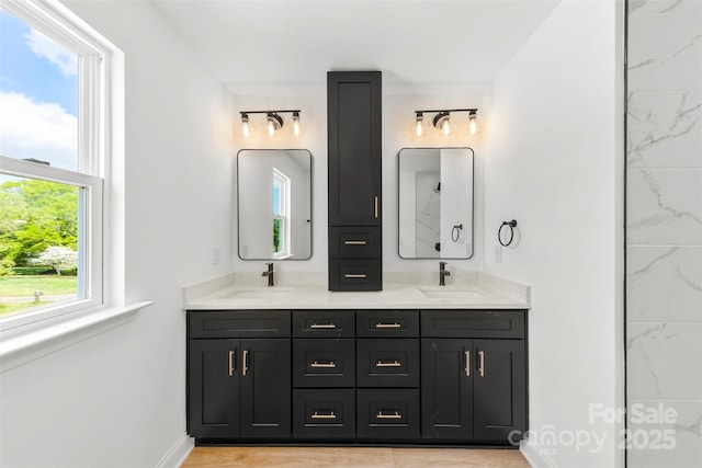 2043 Greenoak Dr, Shelby, NC 28152 - bathroom featuring double vanity, a sink, and baseboards