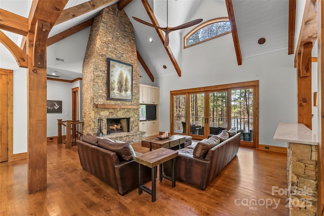 92 Gobblers Neck Dr, Nebo, NC 28761 - living area with wood finished floors, high vaulted ceiling, baseboards, and a stone fireplace