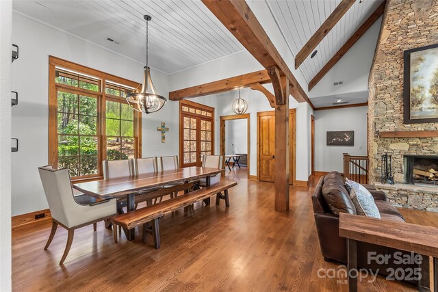 92 Gobblers Neck Dr, Nebo, NC 28761 - dining space featuring a notable chandelier, visible vents, beam ceiling, and wood finished floors