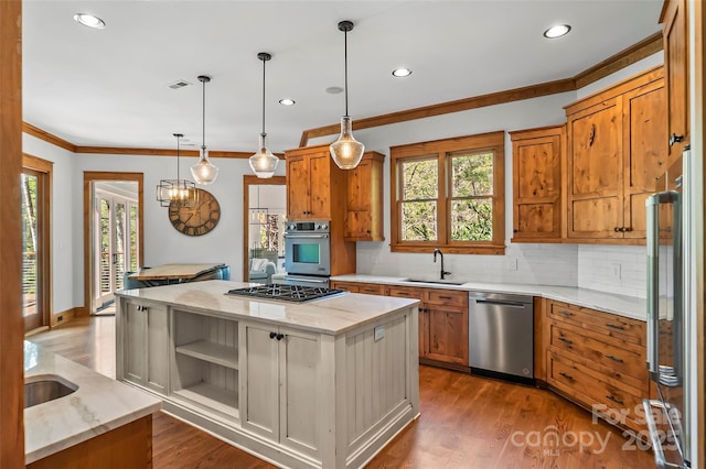 92 Gobblers Neck Dr, Nebo, NC 28761 - kitchen with ornamental molding, a kitchen island, appliances with stainless steel finishes, a sink, and backsplash
