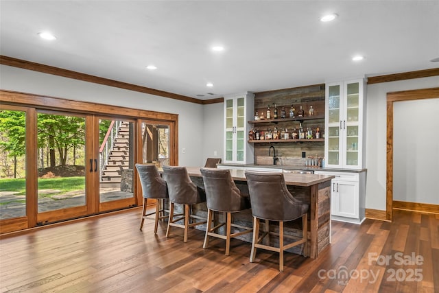 92 Gobblers Neck Dr, Nebo, NC 28761 - bar with baseboards, indoor wet bar, dark wood-style flooring, ornamental molding, and recessed lighting