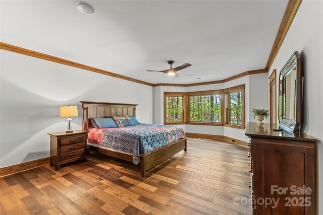 92 Gobblers Neck Dr, Nebo, NC 28761 - bedroom featuring crown molding, baseboards, a ceiling fan, and wood-type flooring