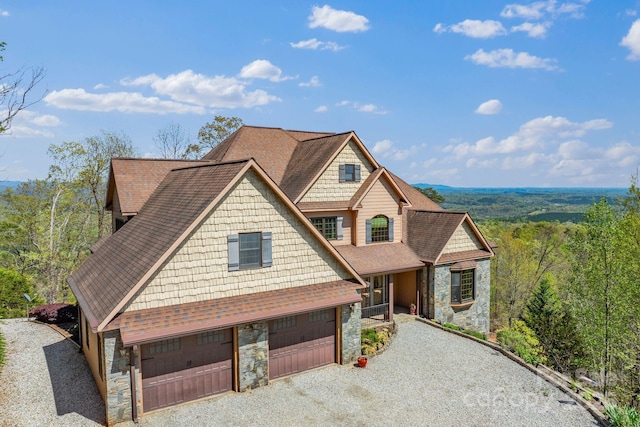 498 Pinnacle Pkwy, Union Mills, NC 28167 - view of front of home featuring a forest view, driveway, stone siding, and a shingled roof