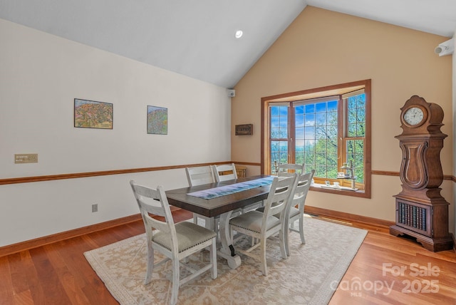 498 Pinnacle Pkwy, Union Mills, NC 28167 - dining area featuring high vaulted ceiling, light wood finished floors, and baseboards