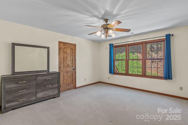 498 Pinnacle Pkwy, Union Mills, NC 28167 - unfurnished bedroom featuring light carpet, visible vents, baseboards, and ceiling fan