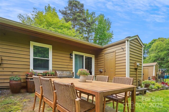 view of patio / terrace featuring outdoor dining space and area for grilling