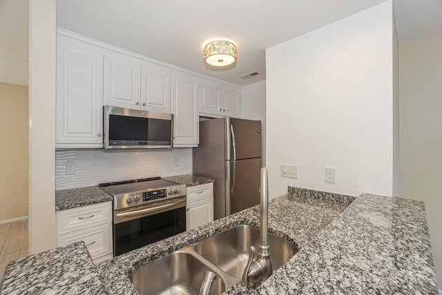 368 NW Dr, Davidson, NC 28036 - kitchen featuring a sink, visible vents, white cabinetry, and stainless steel appliances