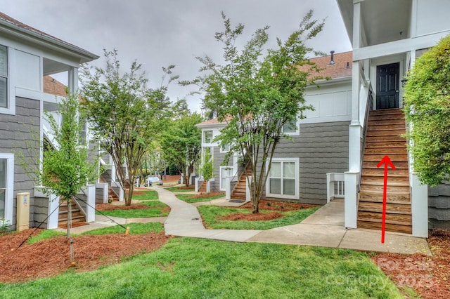 765 SW Dr, Davidson, NC 28036 - view of home's community with a yard and stairs