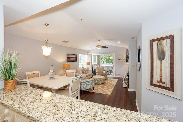 765 SW Dr, Davidson, NC 28036 - living room with baseboards, dark wood-style floors, a ceiling fan, visible vents, and lofted ceiling