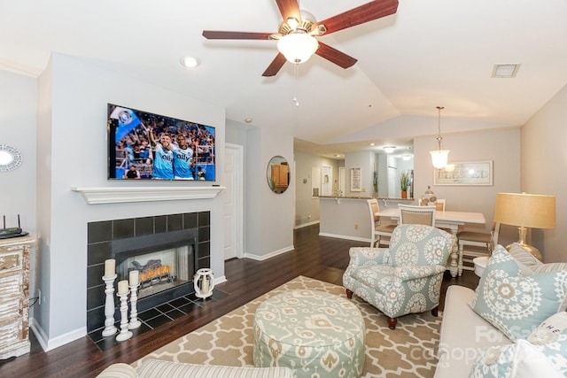 765 SW Dr, Davidson, NC 28036 - living room with baseboards, vaulted ceiling, a ceiling fan, visible vents, and wood finished floors