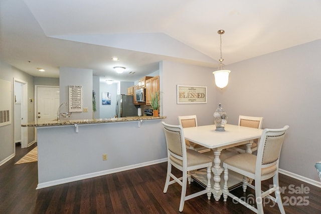 765 SW Dr, Davidson, NC 28036 - dining room featuring dark wood-style flooring, baseboards, and lofted ceiling