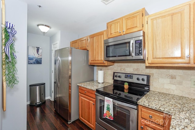 765 SW Dr, Davidson, NC 28036 - kitchen with appliances with stainless steel finishes, decorative backsplash, light stone counters, and dark wood-style floors