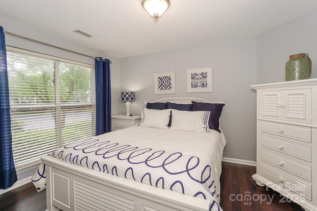 765 SW Dr, Davidson, NC 28036 - bedroom featuring baseboards and dark wood-style floors