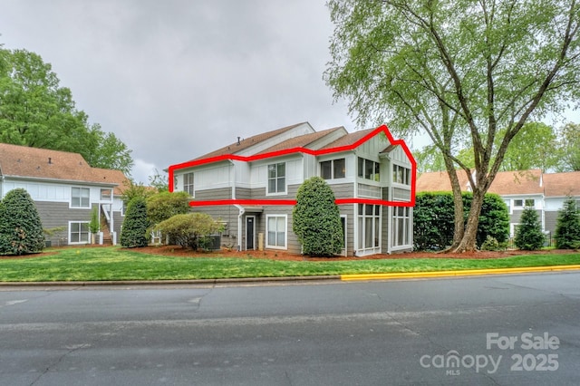 765 SW Dr, Davidson, NC 28036 - view of front of property with a front yard