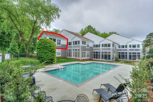 765 SW Dr, Davidson, NC 28036 - pool with fence and a patio