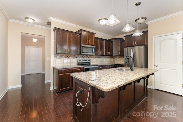 832 Summerlake Dr, Fort Mill, SC 29715 - kitchen featuring dark brown cabinetry, appliances with stainless steel finishes, a sink, baseboards, and backsplash