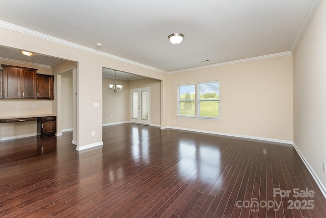 832 Summerlake Dr, Fort Mill, SC 29715 - unfurnished living room featuring baseboards, built in desk, ornamental molding, a chandelier, and dark wood-style floors