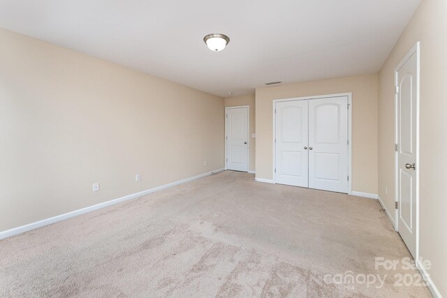 832 Summerlake Dr, Fort Mill, SC 29715 - unfurnished bedroom featuring a closet, baseboards, and carpet floors