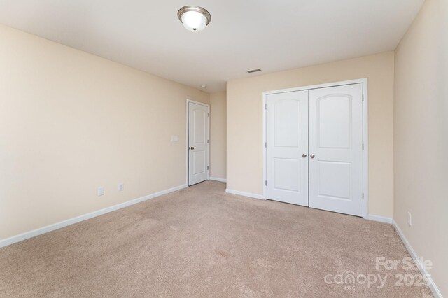 832 Summerlake Dr, Fort Mill, SC 29715 - unfurnished bedroom with a closet, baseboards, and carpet flooring